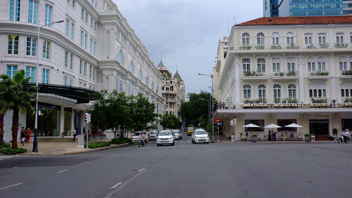 The colonial spine — Opera House, Nguyễn Huệ walking street, Đồng Khởi, the Sheraton and Lotte towers, and the Saigon River behind all of it.