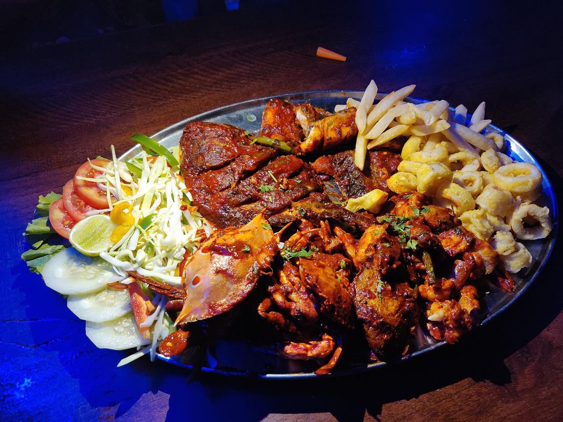 Seafood cooking, representative of the cuisine